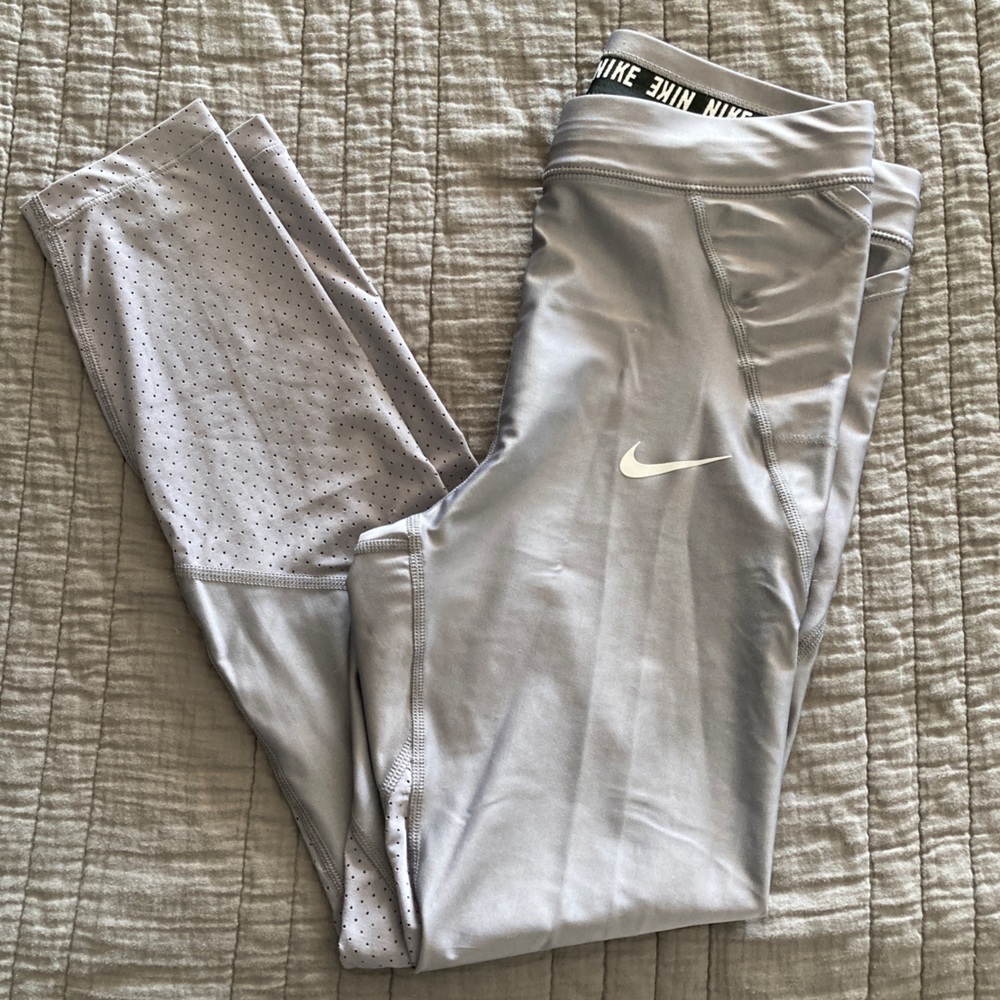Nike women’s silver/grey athletic leggings. Size Medium